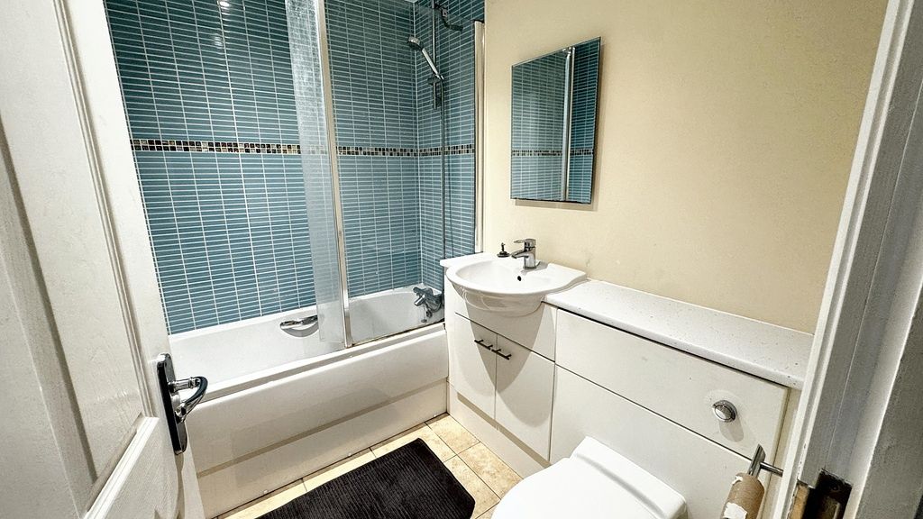 Property photo 2 of 8 Bright, Modern Bathroom With A Combined Shower-Bat...