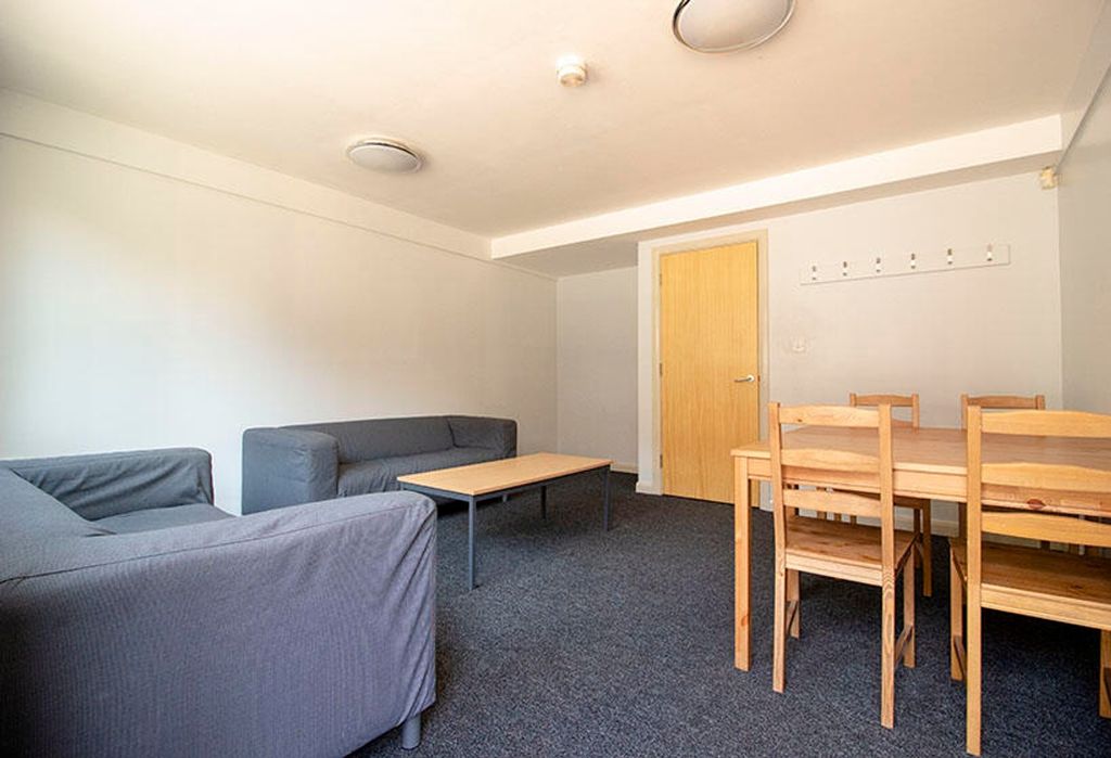 Property photo 2 of 5 A Spacious Living Room Featuring Comfortable Seati...