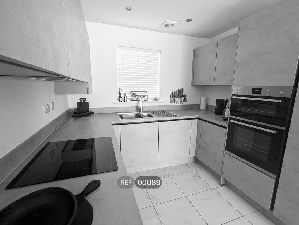 Property photo 2 of 8 Kitchen & Living Area