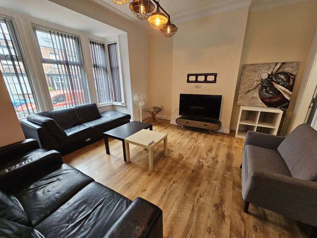 Property photo 3 of 18 Spacious And Well-Lit Living Room Featuring Large ...