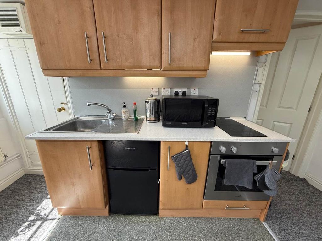 Property photo 2 of 13 Kitchen Area