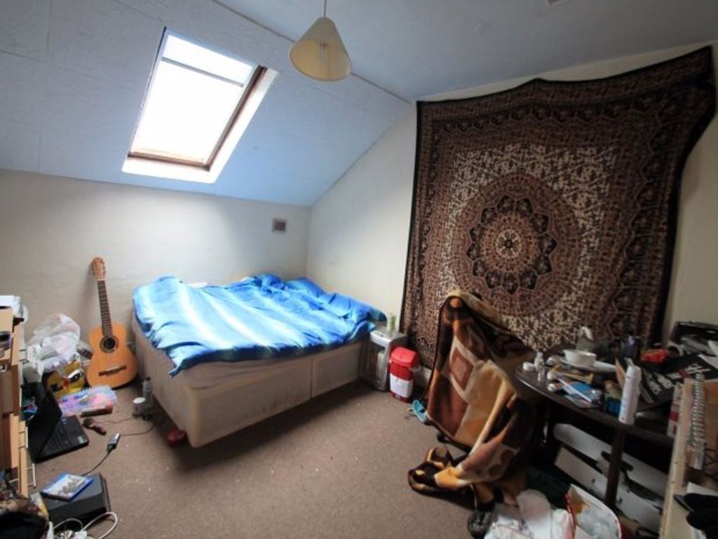 Property photo 2 of 9 Bright And Cozy Bedroom Featuring A Comfortable Do...