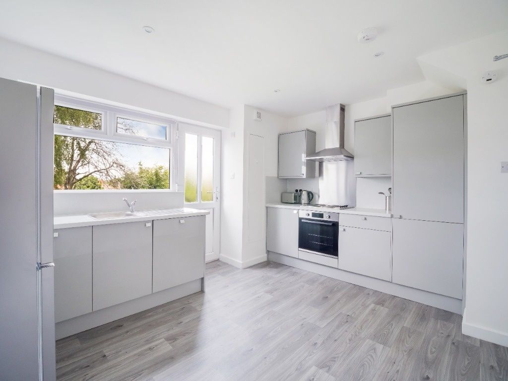 Property photo 2 of 14 Bright, Modern Kitchen With Sleek Grey Cabinets, i...