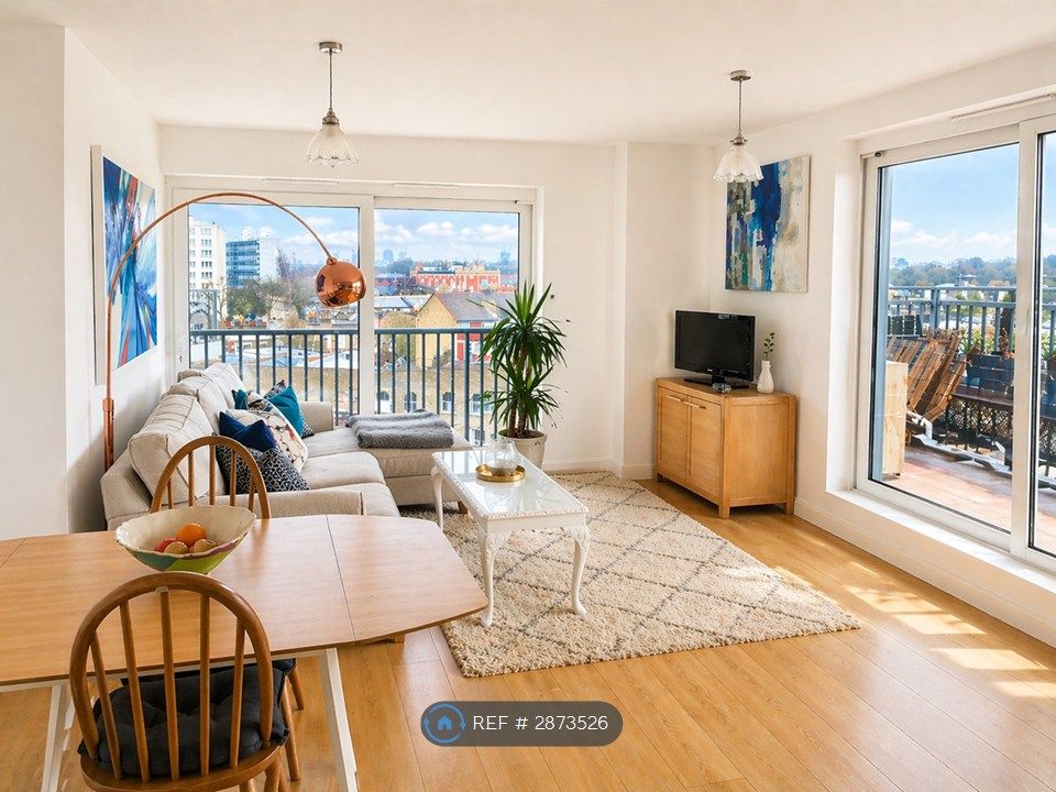 Property photo 3 of 12 Light Airy Living Room Two Sets Of Sliding Doors