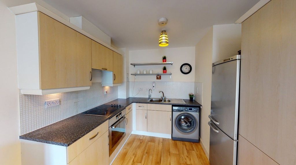 Property photo 3 of 12 Kitchen