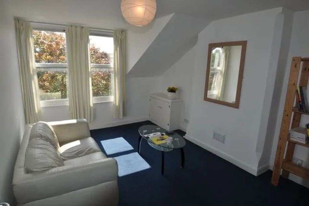 Property photo 2 of 4 A Bright And Inviting Living Room With Ample Natur...