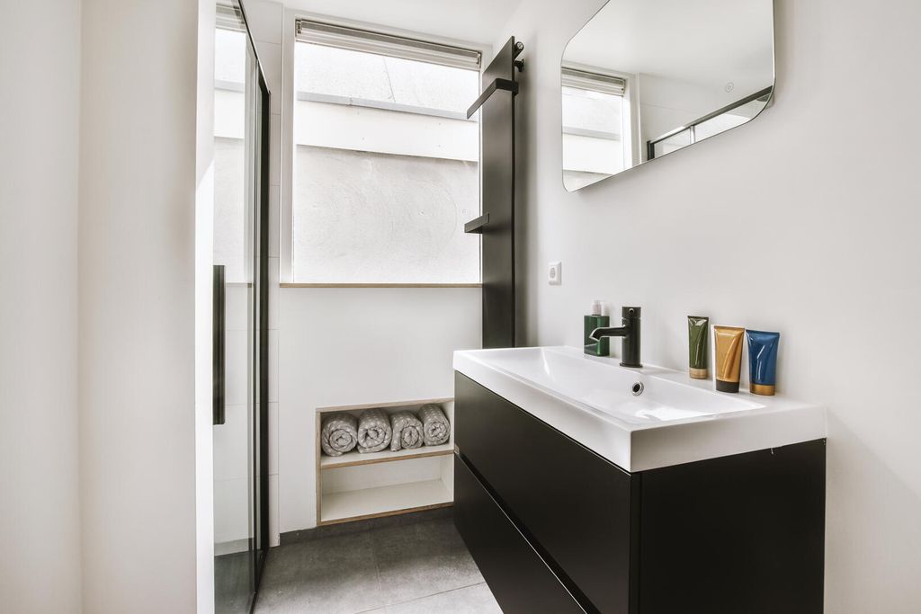 Property photo 3 of 6 Sink-And-Mirror-Near-Bathroom-Door-2025-02-09-23-1