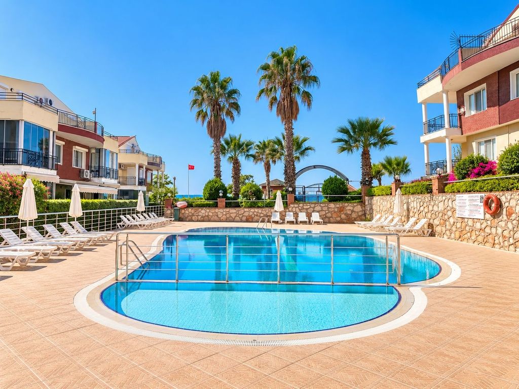 Property photo 2 of 25 Seafront Semi-Detached Villa For Sale In Didim – Communal Swimming Pool
