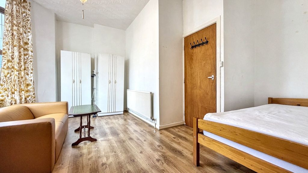 Property photo 3 of 9 Bright, Simply Furnished Bedroom With Wooden Floor...