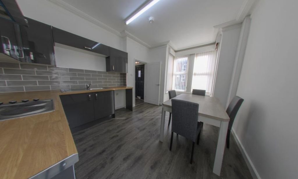 Property photo 1 of 30 Bright And Modern Living Room Featuring Large Wind...