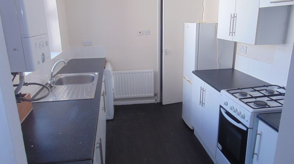 Property photo 2 of 3 Bright Galley Kitchen With Matching White Cabinets...