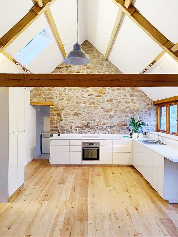 Property photo 1 of 10 Bright, Contemporary Kitchen With White Cabinetry,...