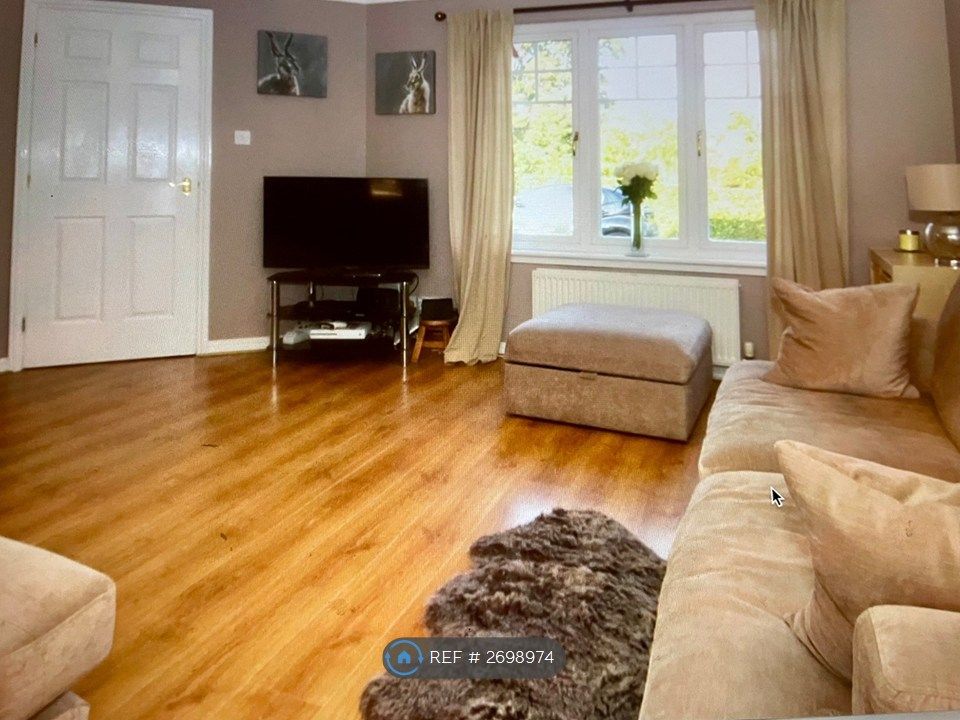 Property photo 2 of 11 Living Room At Front Of House