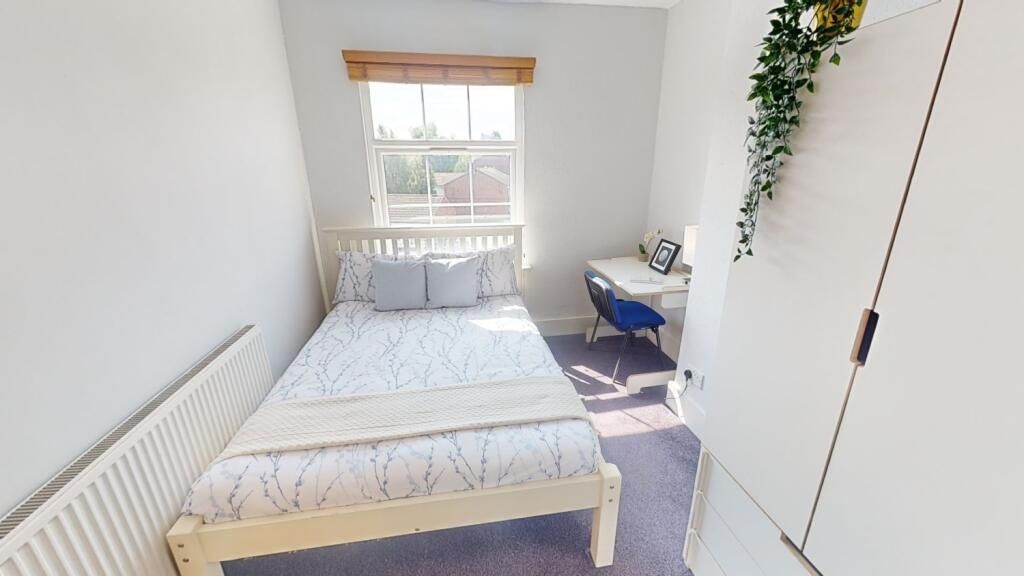 Property photo 1 of 11 Bright And Inviting Master Bedroom Featuring A Com...