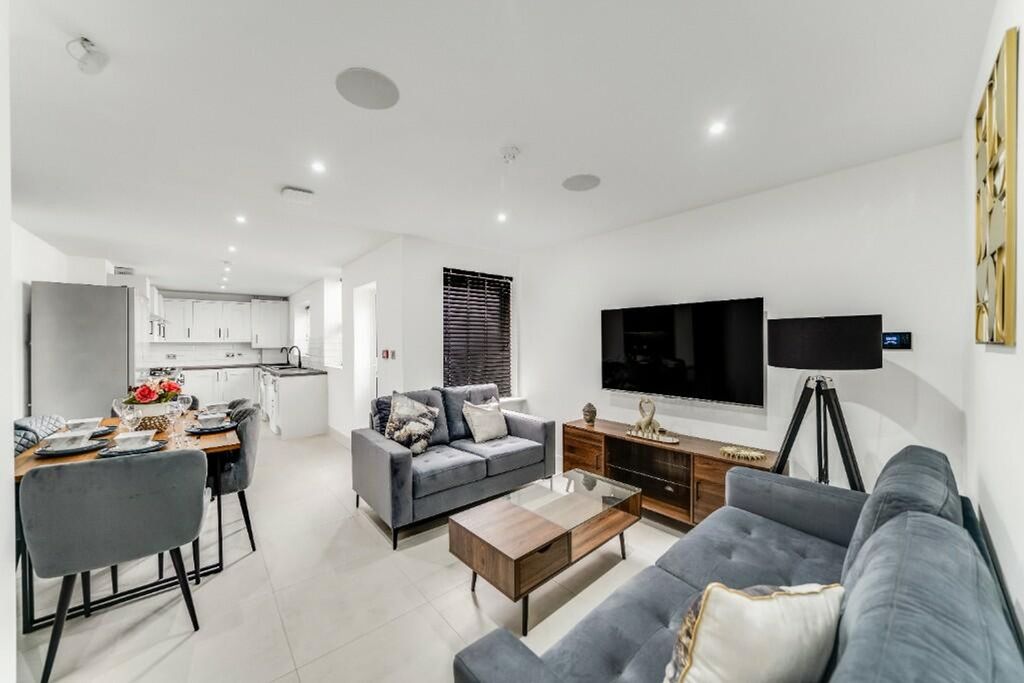 Property photo 1 of 10 A Stylish And Modern Living Room Featuring Ample S...