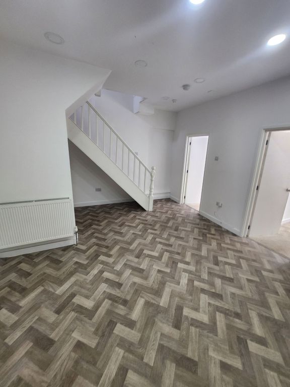 Property photo 2 of 7 Bright And Clean Hallway Featuring Stylish Herring...