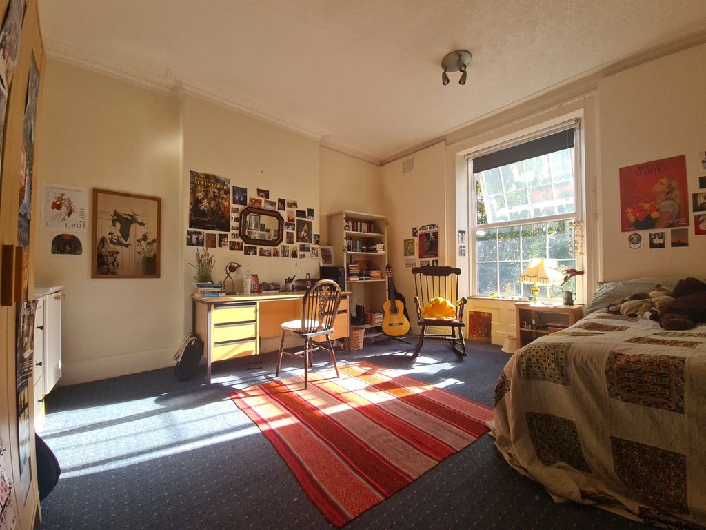 Property photo 3 of 16 Bright And Welcoming Living Room Filled With Natur...