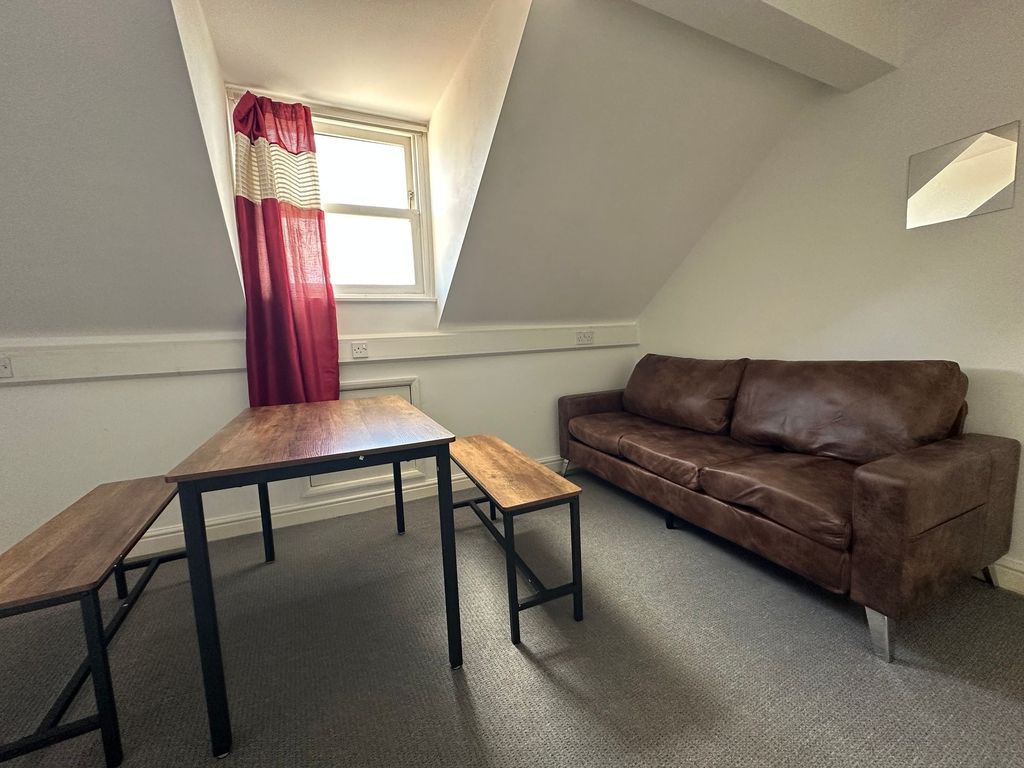 Property photo 3 of 23 A Cozy Living Room Featuring A Rich Brown Leather ...