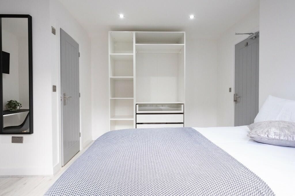 Property photo 2 of 14 Bright And Modern Master Bedroom Featuring A Comfo...