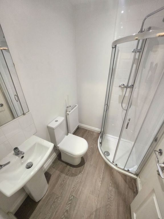 Property photo 2 of 17 Bright, Modern Bathroom With A Curved Glass Shower...