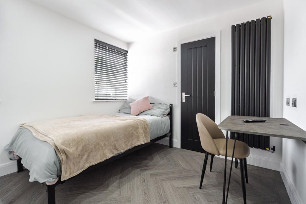 Property photo 1 of 14 A Contemporary Bedroom Featuring A Comfortable Dou...