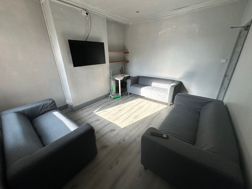 Property photo 2 of 7 A Cozy Living Room Featuring Two Comfortable Sofas...