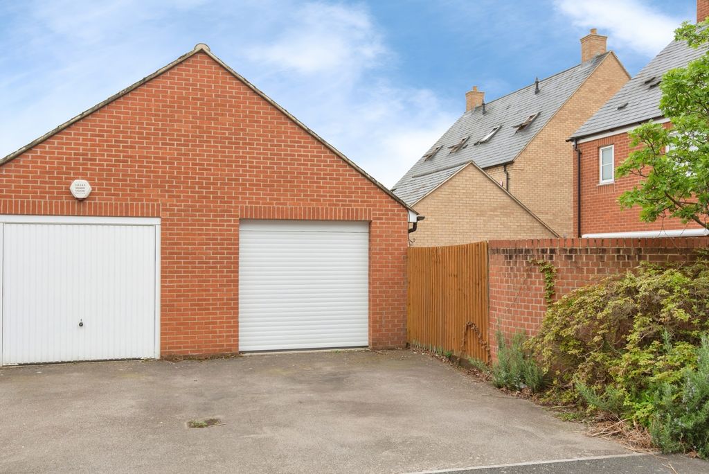 Property photo 2 of 24 Garage And Driveway
