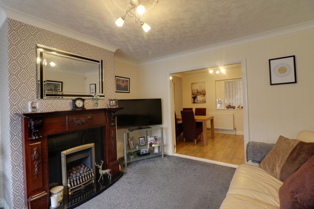 Property photo 1 of 14 Lounge With A Feature Fireplace