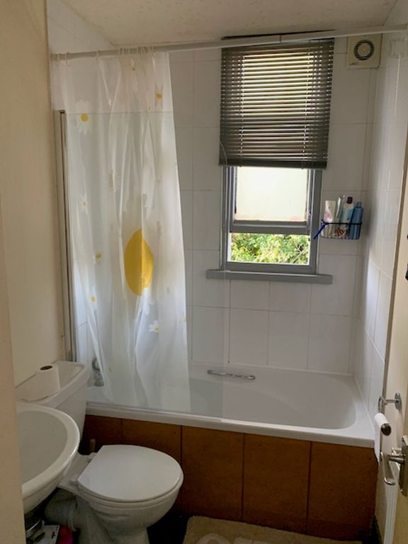 Property photo 3 of 14 A Tidy And Functional Bathroom Featuring A Bathtub...