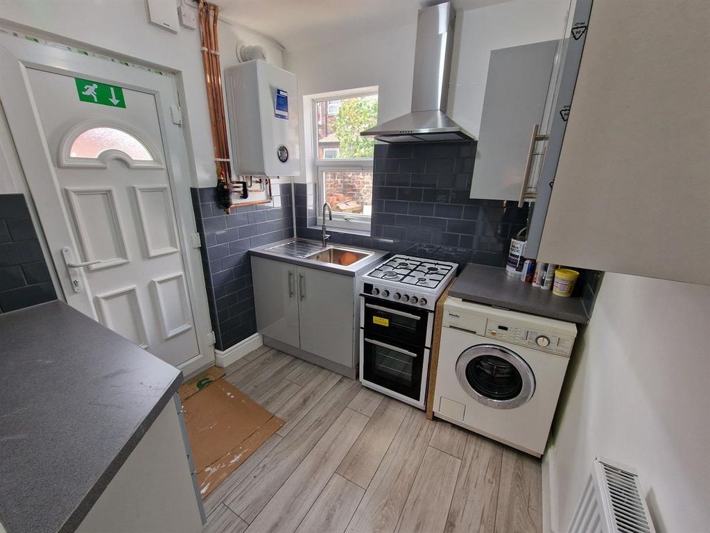 Property photo 1 of 7 A Compact, Modern Kitchen Featuring Clean Countert...