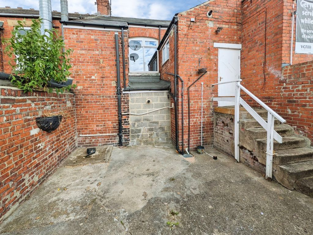 Property photo 2 of 11 Rear Yard & Entrance