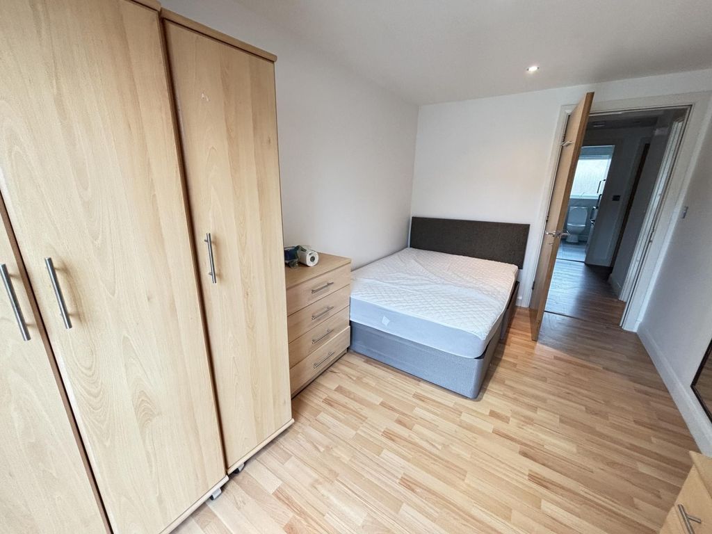 Property photo 3 of 17 A Clean And Bright Bedroom Featuring A Comfortable...