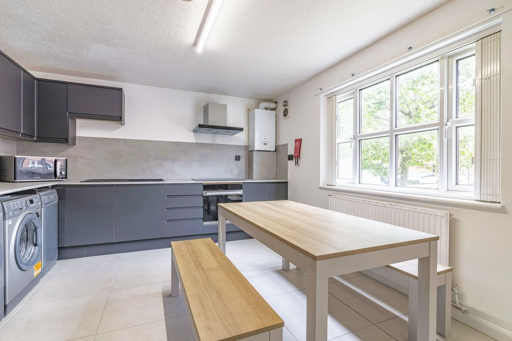 Property photo 1 of 9 Bright And Modern Kitchen With Ample Natural Light...