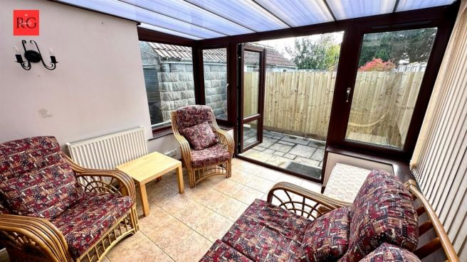 Property photo 3 of 15 A Bright And Inviting Living Room With Large Glass...