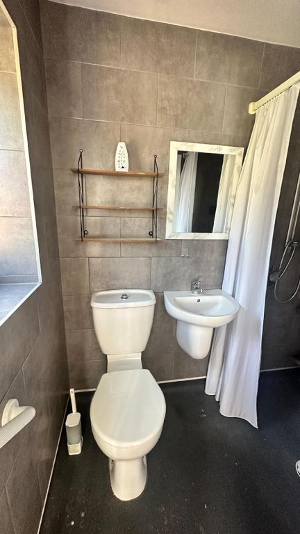 Property photo 2 of 7 A Clean And Functional Bathroom Featuring A Toilet...