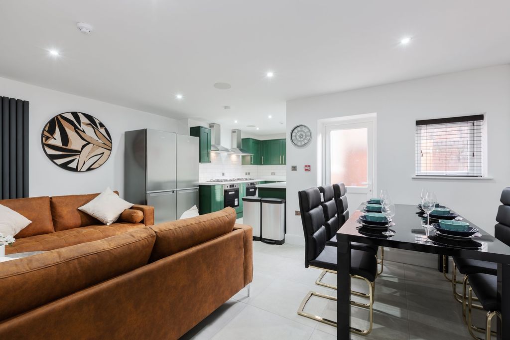 Property photo 1 of 7 A Spacious And Modern Living Room With A Comfortab...