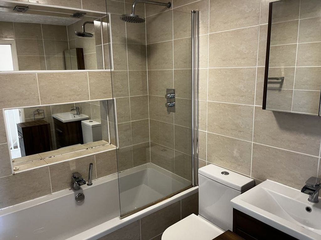 Property photo 1 of 9 This Modern Bathroom Suite Features A Sleek Design...