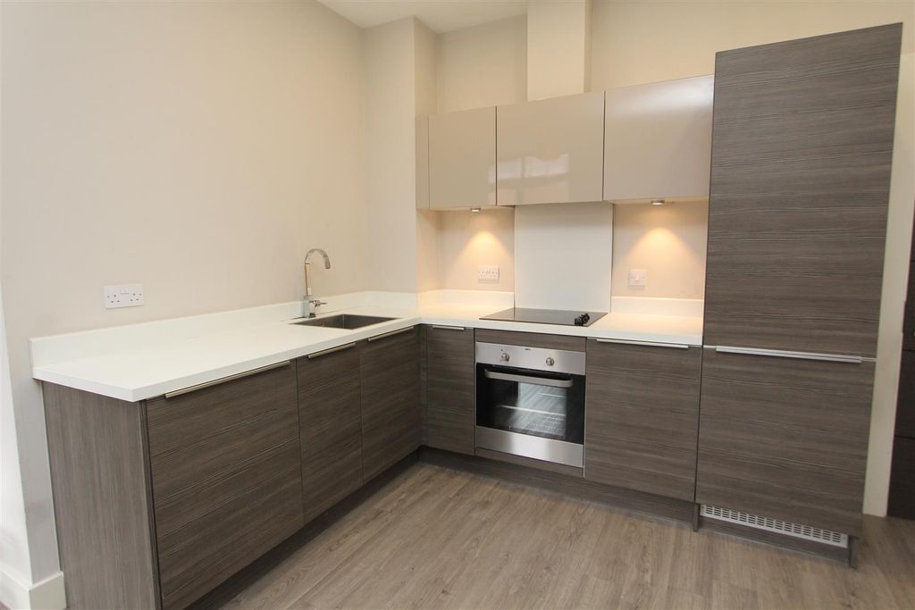 Property photo 3 of 10 Modern Kitchen With Sleek Cabinetry And High-End...