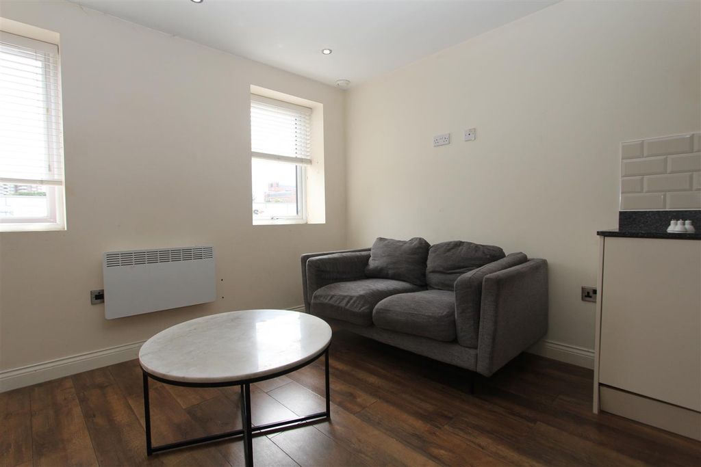 Property photo 3 of 5 Bright Lounge Area With Stylish Marble Table...
