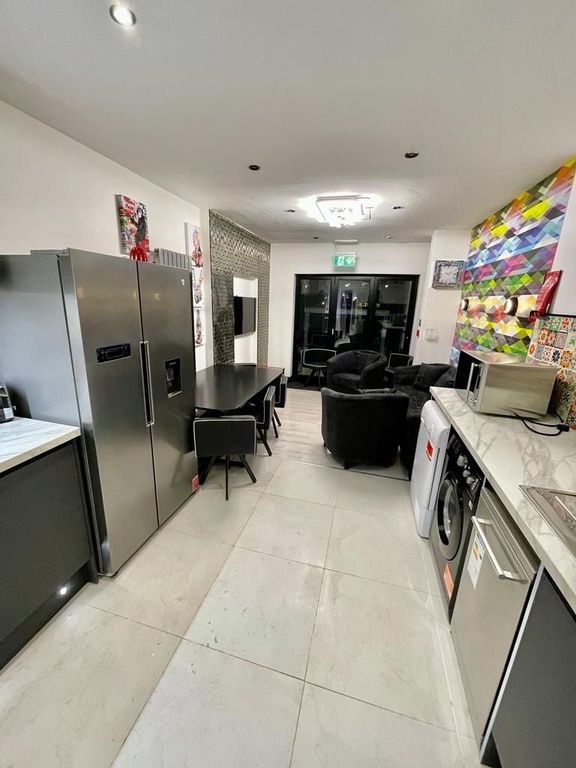 Property photo 2 of 12 Modern Open-Plan Kitchen With Social Seating...
