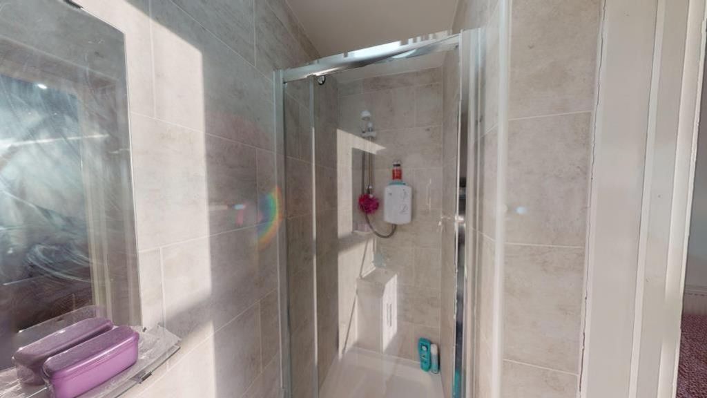 Property photo 3 of 8 A Bright And Clean Bathroom Featuring Modern Fixtu...