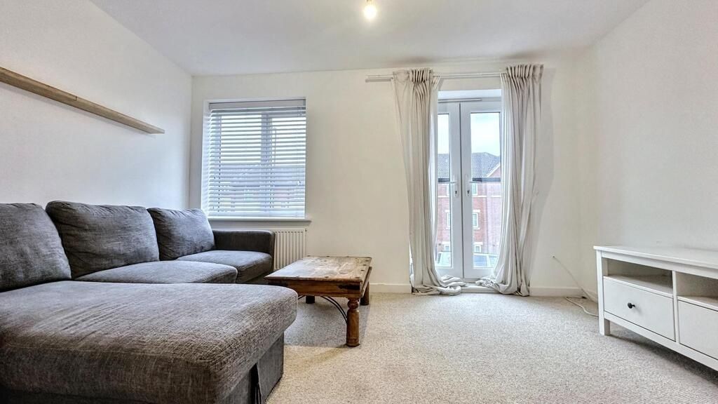 Property photo 1 of 7 A Bright And Tidy Living Room Featuring A Large Gr...