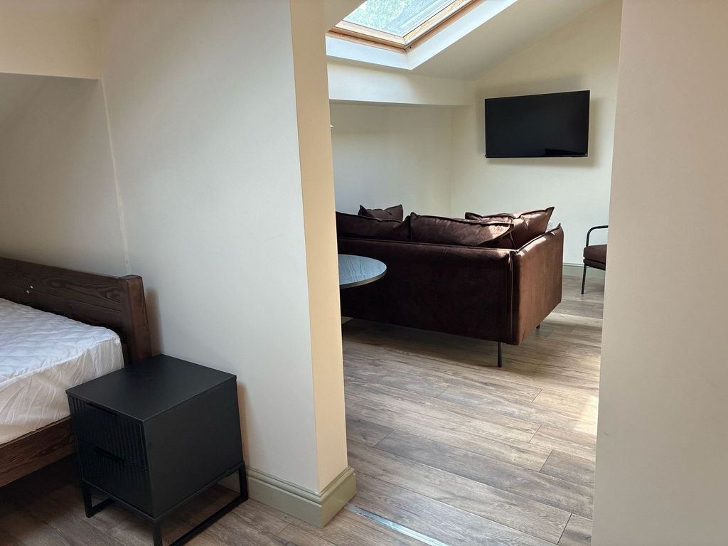 Property photo 3 of 5 Bright Modern Living Area With Skylight And TV...