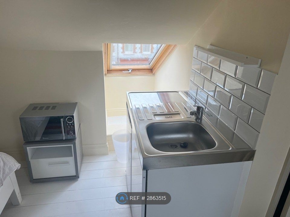 Property photo 3 of 8 Sink And Fridge In Bedroom