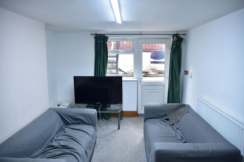 Property photo 3 of 8 A Compact Living Room Featuring Two Sofas, A TV, A...