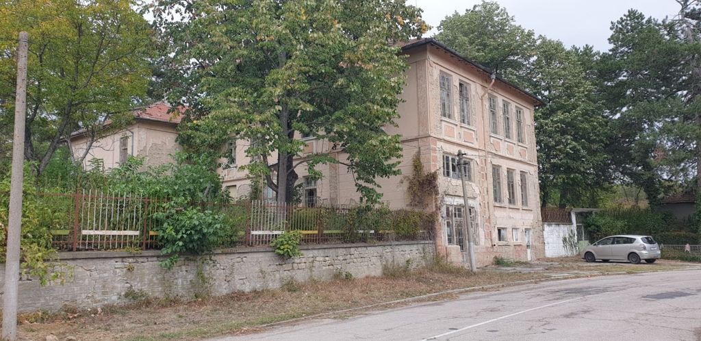 Property photo 3 of 88 View Showing The Building's Side Wall, Trees, And A Car Parked Nearby