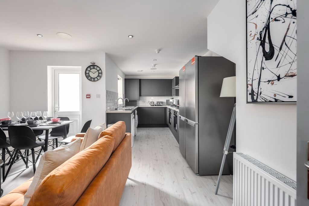 Property photo 1 of 5 Bright And Airy Living Space Featuring A Comfortab...