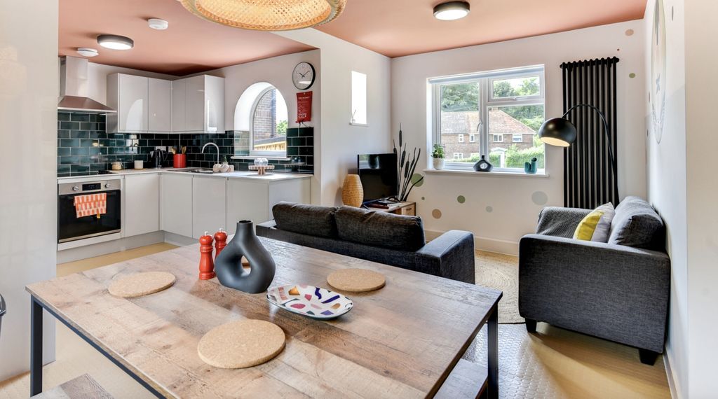 Property photo 3 of 5 Bright And Inviting Living Room Featuring A Stylis...
