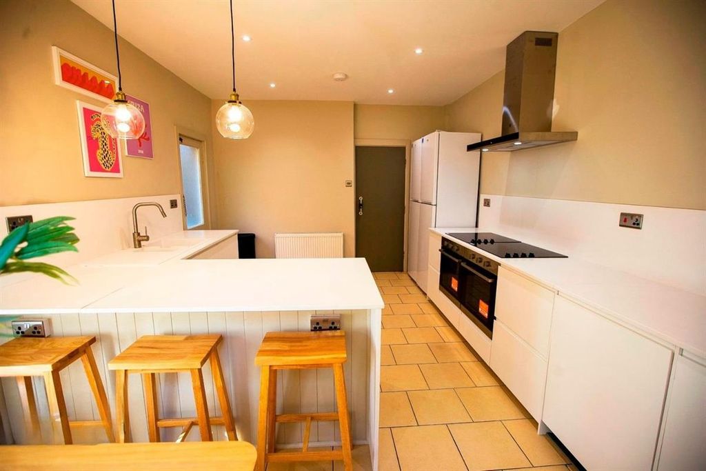 Property photo 3 of 10 Modern Kitchen With Breakfast Bar And Stools...