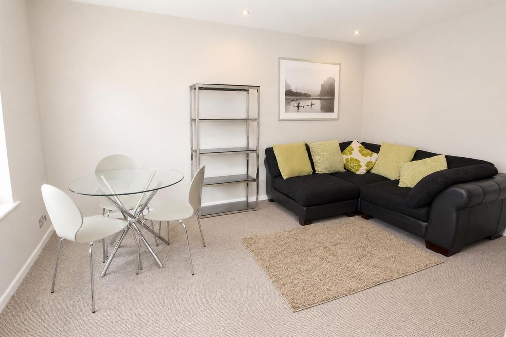 Property photo 1 of 7 Bright Living Room With Stylish Glass Table...